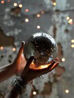 AI generated hands holding a disco ball with a light and stars photo