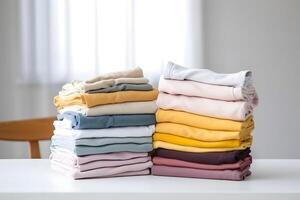 AI generated two colorful stacks of folded clothes on white laundry table, neural network generated photorealistic image photo