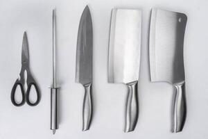 Set of kitchen knives isolated on white background. Kitchen utensils. photo