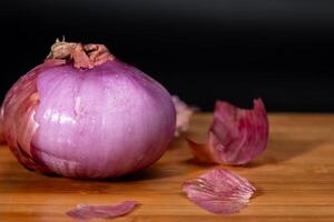 Big shallots on a white background with clipping path. Kind of spices used in cooking. Fresh bulbs of onion on a white background. photo