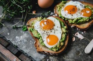 AI generated a heart shaped toast with avocado and eggs on top of a gray tile photo
