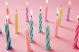 ai generado cumpleaños de colores velas arreglado en un rosado antecedentes foto