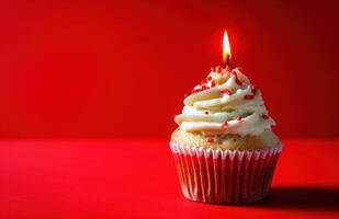 AI generated cupcake with a candle against red background, photo