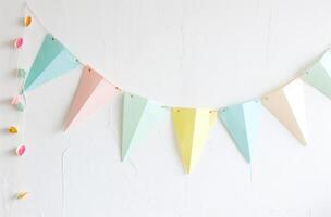AI generated the bunting is hanging from a white wall against a white wall photo