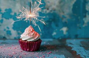 AI generated sparkly cupcake with sparkling sparkler on a blue background photo