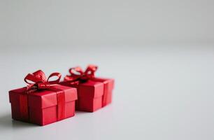 ai generado dos rojo regalo cajas en un blanco antecedentes foto