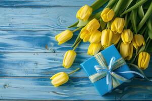 AI generated yellow tulips with blue gift box on blue wooden background photo