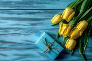 ai generado amarillo tulipanes con azul regalo caja en azul de madera antecedentes foto