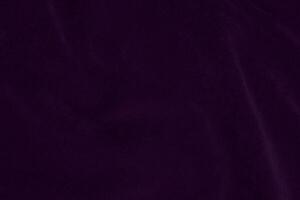 Dark purple velvet fabric texture used as background. violet color purple fabric background of soft and smooth textile material. crushed velvet .luxury dark tone for silk. photo