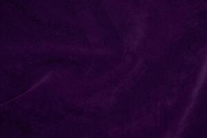 Dark purple velvet fabric texture used as background. violet color purple fabric background of soft and smooth textile material. crushed velvet .luxury dark tone for silk. photo