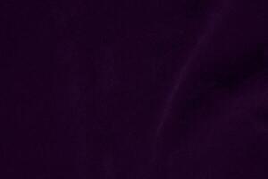 Dark purple velvet fabric texture used as background. violet color purple fabric background of soft and smooth textile material. crushed velvet .luxury dark tone for silk. photo
