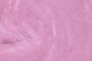 ligero rosado terciopelo tela textura usado como antecedentes. seda color sakura tela antecedentes de suave y suave textil material. aplastada terciopelo .lujo Cereza florecer ligero tono para seda. foto