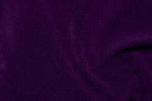 Dark purple velvet fabric texture used as background. violet color purple fabric background of soft and smooth textile material. crushed velvet .luxury dark tone for silk. photo