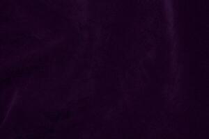 Dark purple velvet fabric texture used as background. violet color purple fabric background of soft and smooth textile material. crushed velvet .luxury dark tone for silk. photo