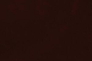 oscuro rojo terciopelo tela textura usado como antecedentes. seda color escarlata tela antecedentes de suave y suave textil material. aplastada terciopelo .lujo oscuro tono para seda. foto