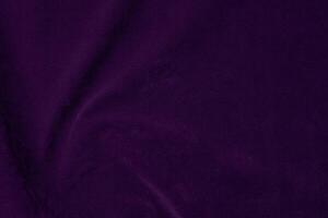 Dark purple velvet fabric texture used as background. violet color purple fabric background of soft and smooth textile material. crushed velvet .luxury dark tone for silk. photo