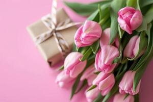 AI generated pink tulips, a gift wrapped with ribbon and pink flowers photo