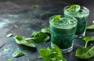 AI generated homemade spinach juice with green leaves photo