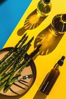 AI generated a plate of asparagus, a bottle of dressing, and skewers photo