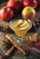 AI generated an apple cider cocktail is garnished with two apples photo