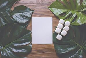 AI generated a white paper on a table next to large green leaves photo