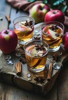 AI generated three glasses of apple cider with apples and spices photo