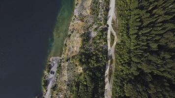 Morning quiet river with forest. Shot. Aerial View. Flying over the beautiful mountain River and forest. Aerial camera shot. Aerial panorama of the green forest and near mountain river. Landscape photo