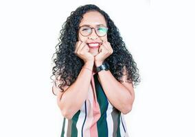 Cheerful and friendly afro young woman looking and smiling at the camera. Portrait of friendly afro girl in glasses smiling isolated. Young Nicaraguan woman smiling at camera photo