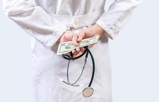 Corrupt doctor hiding money back, Dishonest doctor hiding money. Medical corruption and bribery concept photo