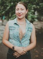 Portrait of attractive latin girl smiling outdoors. Portrait of Latin American girl face looking and smiling at the camera. Portrait of young Nicaraguan woman smiling at camera photo