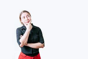 Pensive young woman with hand on chin meditating isolated. Beautiful girl thinking with hand on chin looking up photo