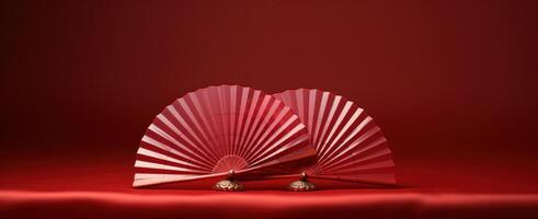 AI generated two iridescent red fan models lying on a red background, photo