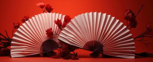 AI generated two iridescent red fan models lying on a red background, photo