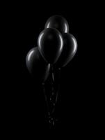 AI generated A bunch of black balloons cinematic photo on a black background. High-resolution. AI Generative