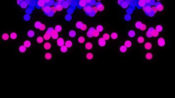 bokeh schijnend kleurrijk deeltjes. glinsterende glinsterende deeltjes lus animatie met zwart achtergrond video