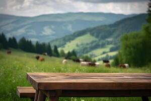 AI generated wooden table on the background of blurred alps green meadow with cows at sunny summer day, neural network generated image photo