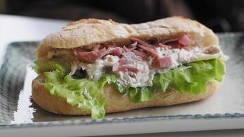 Sandwich With Smoked Chicken Salami on table video