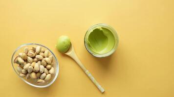 top view a pistachios cream and nuts in a bowl video