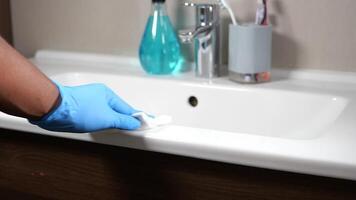 Hand in gloves cleaning the bathroom video