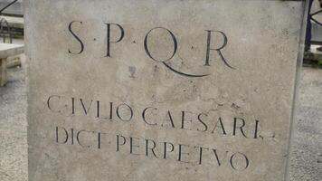 Roman writing and bas-reliefs imperial era archeology italy. Stock. SPQR inscription on the wall photo