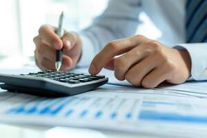 AI generated Financial data analyzing counting concept for Businessman's hands with calculator and laptop on desk in modern office. Generative AI photo