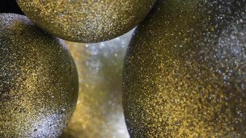 Close-up of Golden balls. Concept. Christmas balls shiny and gold macro photo