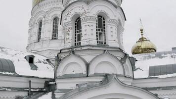 Facade of the orthodox church with golden domes. Clip. Concept of religion and architecture. photo