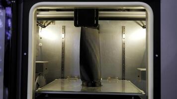 Large 3d printer. Media.A huge 3D printing machine with internal illumination. photo