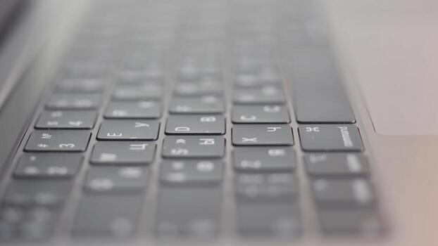Close up of computer black keyboard. Action. Technological background with the new modern flat keypad of the laptop. photo
