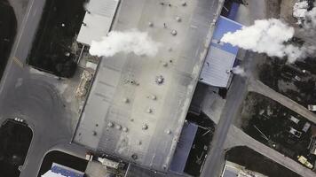 Plant for the production of cement, clinker and gypsum. Stock footage. Aerial view of concrete mixing factory, industrial zone on a sunny summer day. photo