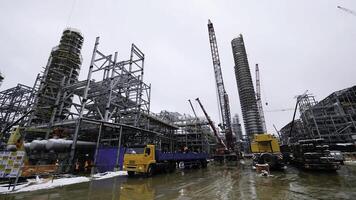 Metal construction of the future plant. Industrial zone,The equipment of oil refining,Close-up of industrial pipelines of an oil-refinery plant,Detail of oil pipeline with valves in large oil refinery photo