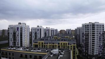 A sunny daytime exterior of a typical upscale apartment building. Stock footage. Aerial view of a summer city street with beautiful buildings. photo