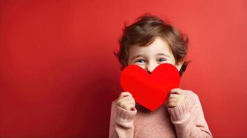 AI generated A shy little boy holding a paper heart shape and hiding behind it on grey background photo