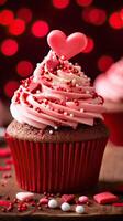 AI generated Close up delicious cupcake for Valentine Day on red bokeh blur background photo